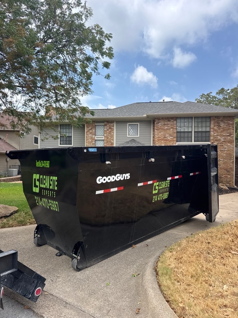 Clean Site Experts dumpster on a residential driveway